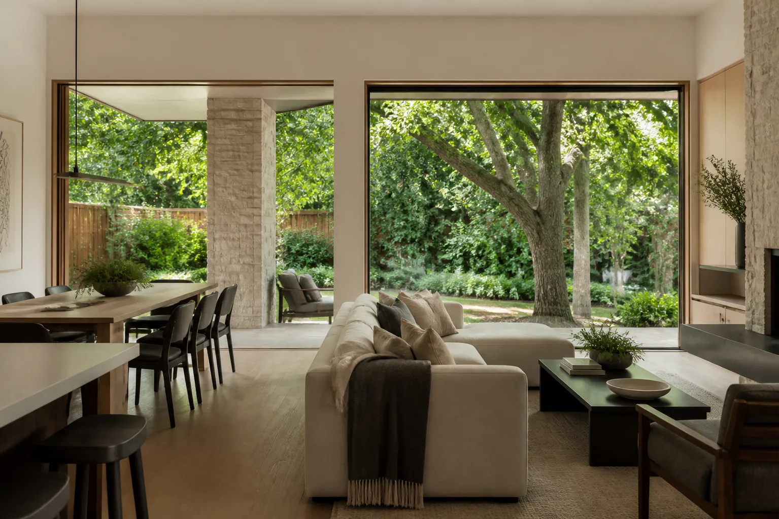 Custom-home living space planned around a mature tree and private Calgary garden