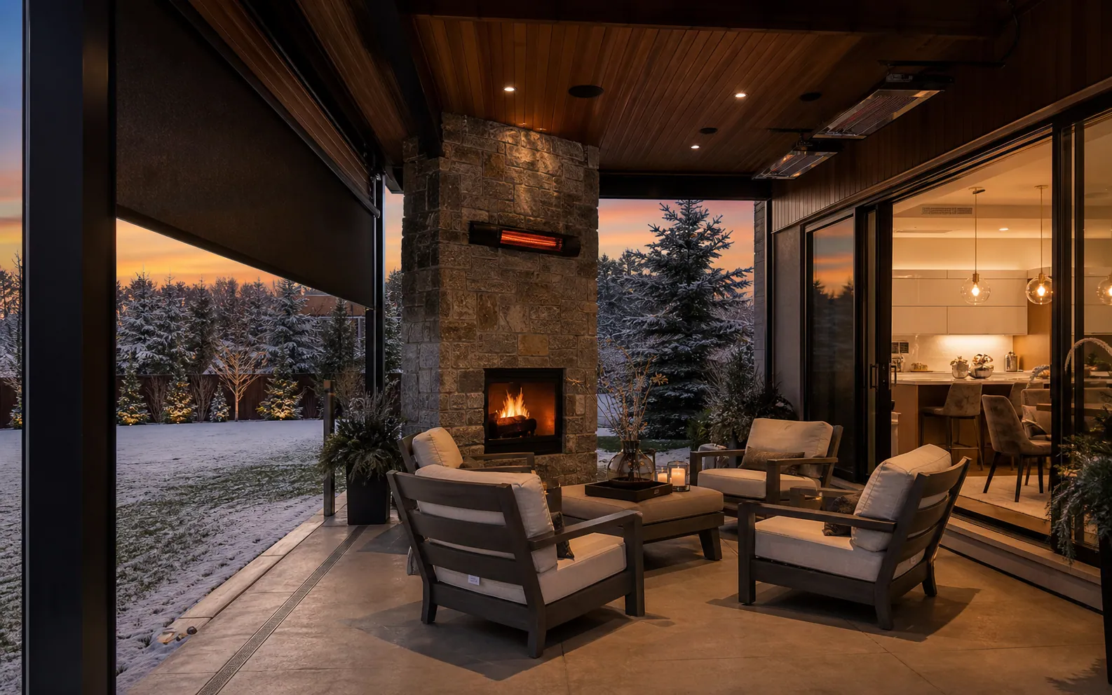 Protected Calgary covered patio with wind screens, radiant heaters, a stone fireplace, and direct access to the kitchen